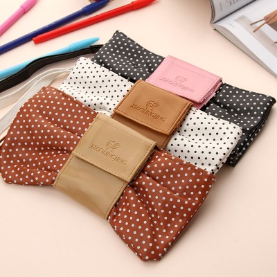 http://www.toyhope.com/59080-thickbox/pencil-bag-stationery-bag-lovely-bow-tie-design-pu-w2142.jpg